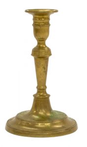Brass candlesticks of the 18th century tended to be more delicate and graceful than their wooden counterparts.