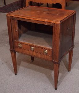 Tambour doors slide in a groove allowing them to retract within the case.