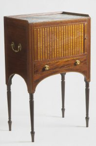 A Seymour stand with tambour door front.