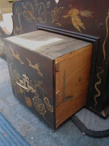 Tapered pins on the drawer fronts allow for zero clearance fronts while giving the drawer boxes just enough slop to move freely.