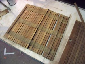 Roll-top desk lid with canvas strips.