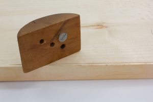 A simple, shop-made scratch stock from a scrap and a screw.