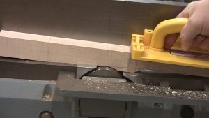 The final step to make tapered legs at the jointer is to pivot the foot down to the bed.