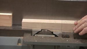The first step to creating tapered legs on the jointer is to create the pivot point.
