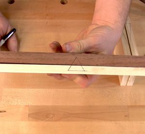 Stacking the drawer front and back together, the triangle is drawn so it is split horizontally.