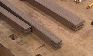 For a mitered box joint, one half the joint is cut as usual, the other half ends with one double thick finger.