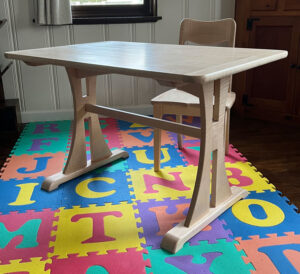 A child's table set at an angle. 